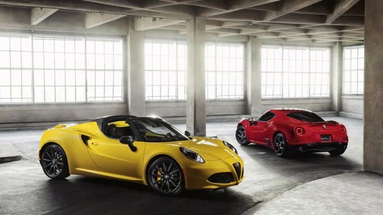 a yellow and red alfa romeo 4c in a light-filled industrial hangar, alfa romeo 4c spider, alfa romeo, cars, automobiles, compartment, discs, wheels, headlights, interiors, sports cars, auto, vehicles