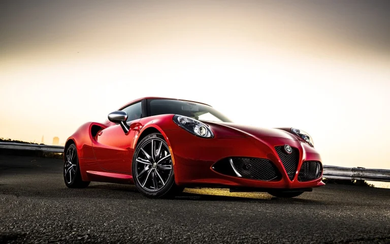 a red alfa romeo 4c on an empty road, alfa 4c spider red, alfa romeo, cars, automobiles, compartment, discs, wheels, headlights, roads, highways, motorways, avenues, driveways, passageways, sports cars, sun, sun rays, sunlight, rays, sunsets, sunset, auto, vehicles