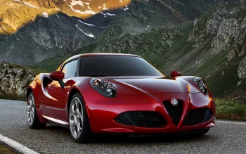 красная alfa romeo 4c на фоне заснеженных итальянских альп в лучах заката, alfa romeo 4c red, alfa romeo, альфа ромео, горы, вершины, холмы, диски, колеса, дороги, пути, трассы, шоссе, магистрали, автострады, проспекты, проезды, закаты, закат, купе, машины, автомобили, обрывы, утёсы, спорткары, авто