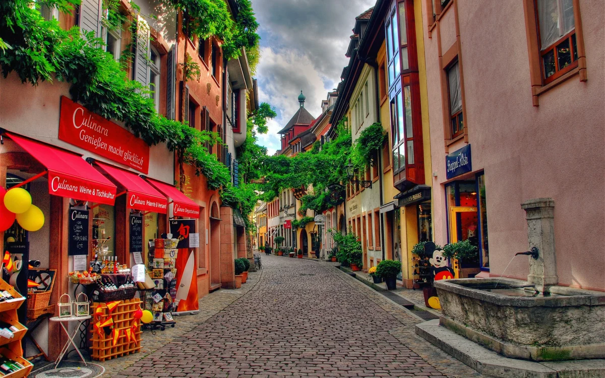 A cozy little street with flower-adorned facades in a German city
