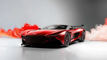 Червоний Aston Martin Vulcan у хмарах диму