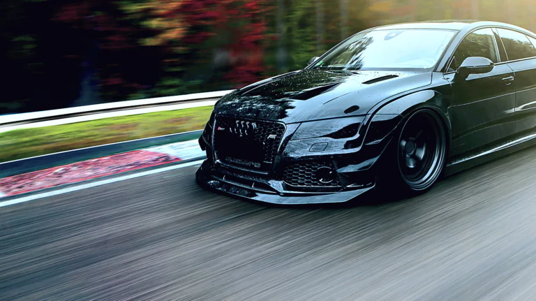 Черная Audi RS7 в тюнинге от ABT на гоночном треке
