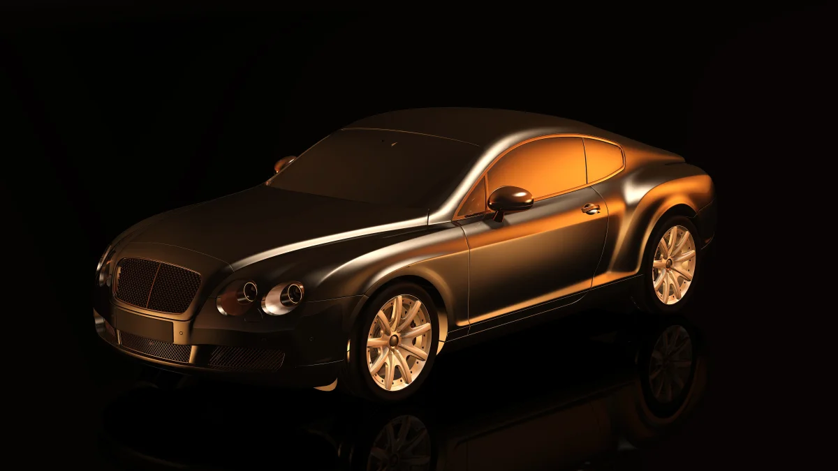 Bentley Continental GT у променях м'якого світла на чорному тлі