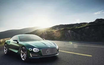 зелений bentley exp 10 speed 6 на тлі гірських схилів, bentley exp 10 speed 6, bentley, бентлі, гори, вершини, пагорби, диски, колеса, дороги, шляхи, траси, шосе, магістралі, автостради, проспекти, проїзди, купе, машини, автомобілі, небо, ранок, світанки, світанок, сонце, сонячні промені, сонячне світло, спорткари, фари, авто