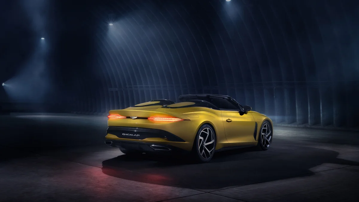 A yellow Bentley Bacalar in the dim light of the hangar
