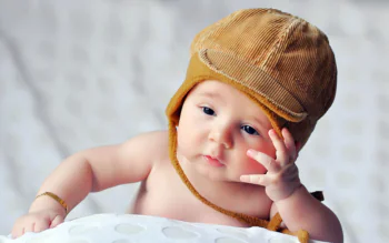A little boy in a corduroy cap
