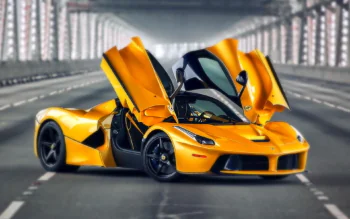 A bright yellow Ferrari LaFerrari with its doors open on an empty highway