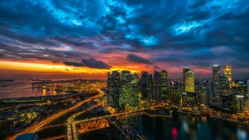 the lights of singapore at night against the backdrop of a vibrant sunset, singapore, bays, coves, straits, fjords, cities, city, cityscape, cityscapes, clouds, evening, evenings, twilight, dus, night lights, lights, streetlights, street lamps, lighting, night, roads, highways, motorways, avenues, driveways, passageways, sky, skyscrapers, sunsets, sunset, architecture, world