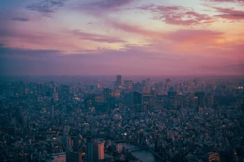 a pink sunset over tokyo at dusk, tokyo, japan, cities, city, cityscape, cityscapes, clouds, evening, evenings, twilight, dus, night lights, lights, streetlights, street lamps, lighting, night, sky, skyscrapers, sunsets, sunset, architecture, world