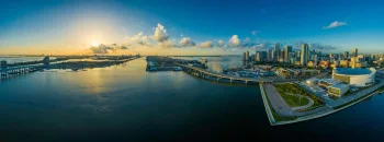 a golden sunrise over the skyscrapers of miami, miami, usa, bays, coves, straits, fjords, bridges, cities, city, cityscape, cityscapes, clouds, docks, piers, panoramas, sky, skyscrapers, sun, sun rays, sunlight, rays, sunsets, sunset, united states, yachts, architecture, world