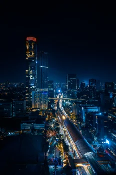 the night lights of jakarta and the light trails of trains, gama tower, indonesia, cities, city, cityscape, cityscapes, jakarta, night lights, lights, streetlights, street lamps, lighting, night, roads, highways, motorways, avenues, driveways, passageways, skyscrapers, the city at night, trains, architecture, world