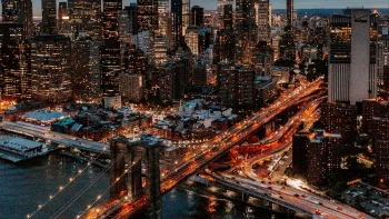 the lights of new york city at night, with a view of the brooklyn bridge, brooklyn bridge, manhattan, bridges, cars, automobiles, cities, city, cityscape, cityscapes, new york, night lights, lights, streetlights, street lamps, lighting, night, roads, highways, motorways, avenues, driveways, passageways, skyscrapers, the city at night, usa, united states, architecture, world