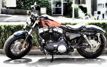 a harley-davidson forty-eight motorcycle on a city street, harley-davidson forty-eight, cruiser motorcycles, cruisers, american classic motorcycles, harley-davidson, motorcycles, bikes, roads, highways, motorways, avenues, driveways, passageways, shrubs, spokes, streets, harley davidson, technology