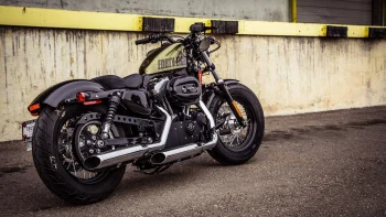 a harley-davidson forty-eight motorcycle against the backdrop of a concrete wall, harley-davidson forty-eight, cruiser motorcycles, cruisers, american classic motorcycles, harley-davidson, motorcycles, bikes, spokes, harley davidson, technology