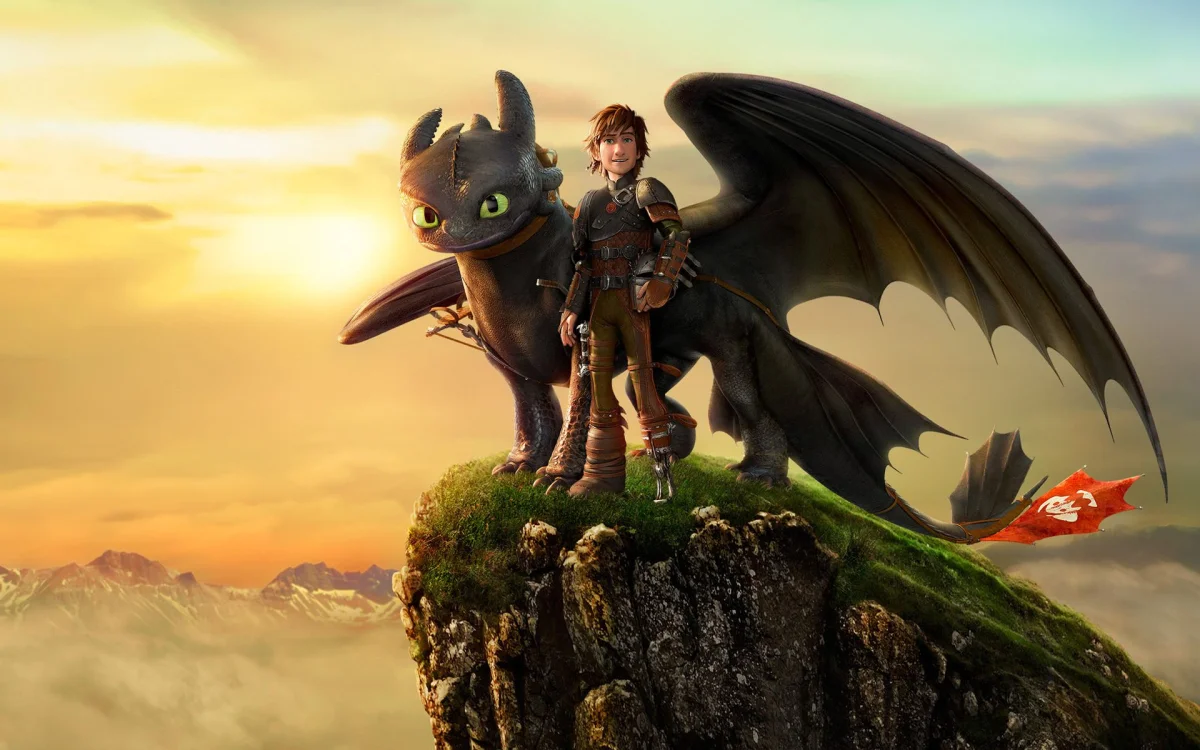 Ikking and Toothless on top of the cliff