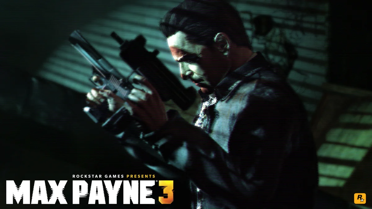 Max Payne, armed and standing in the dim light