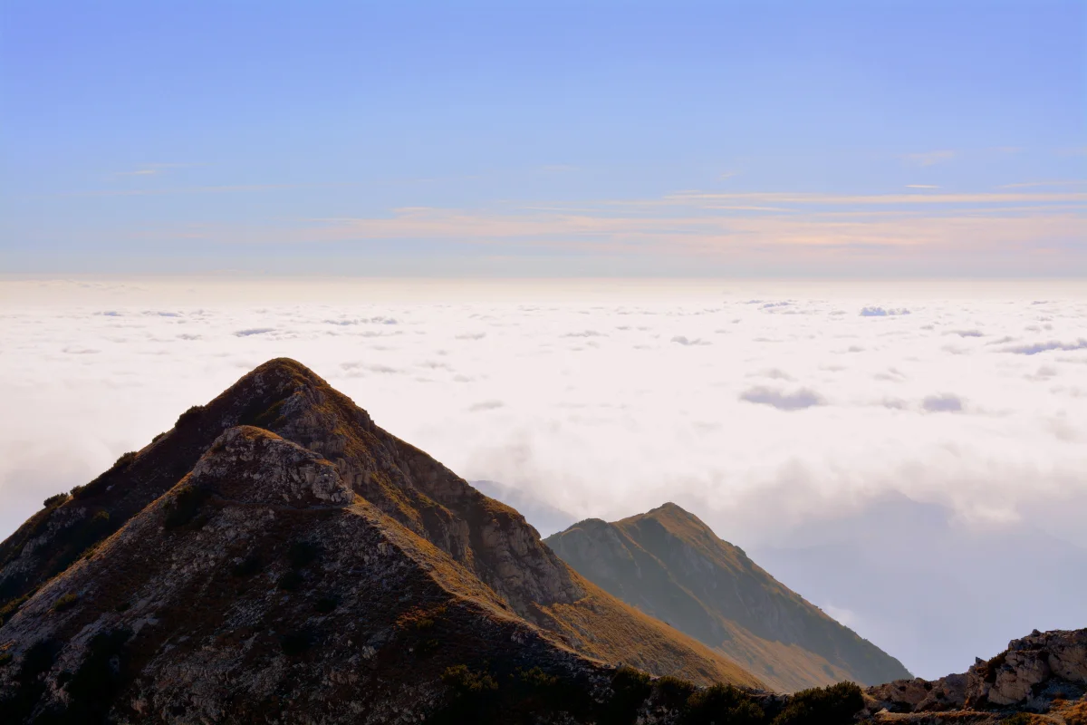 Mountain Peaks Above a Sea of Clouds in Italy