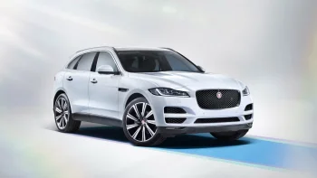 A white Jaguar F-Pace under studio lighting