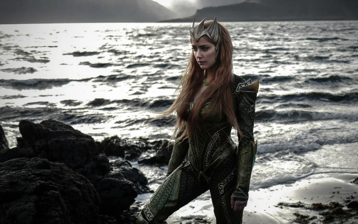 A figure in armor on the shore of the raging ocean