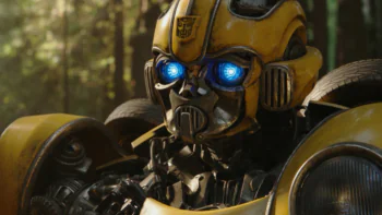 A close-up of Bumblebee with glowing blue eyes in the forest