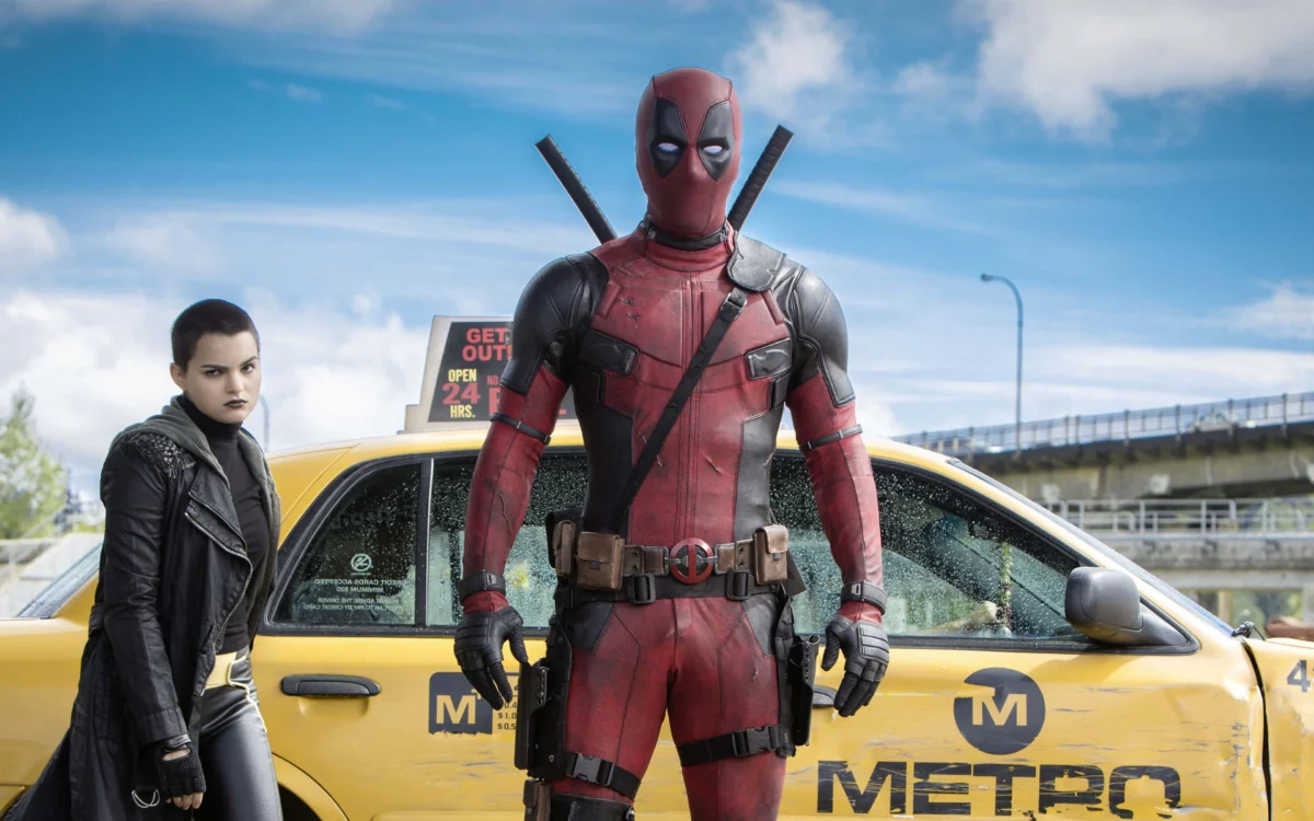Deadpool and Hypersonic Warhead in front of a yellow taxi