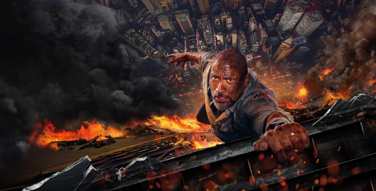 Dwayne Johnson as Will Sawyer against the backdrop of a burning skyscraper in Hong Kong
