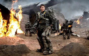 tom cruise in an exoskeleton on the battlefield in the movie "edge of tomorrow", the edge of the future, battles, fights, combats, characters, actors, cinema, cyborgs, destruction, fire, fires, science fiction, smoke, tom cruise, weapon, movies