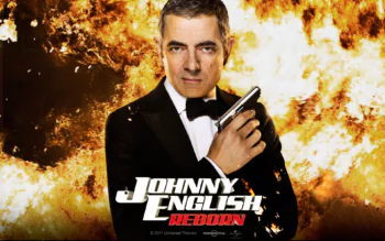 Rowan Atkinson as Johnny English against the backdrop of a fiery explosion