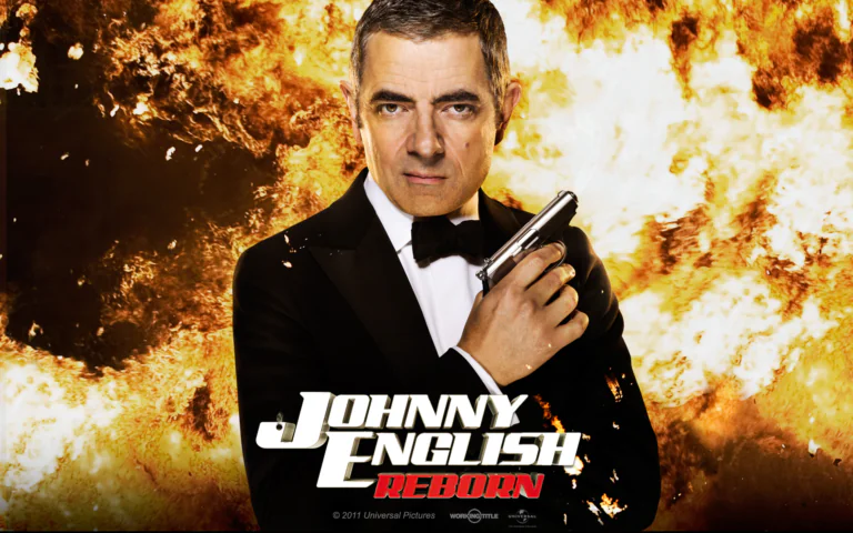 Rowan Atkinson as Johnny English against the backdrop of a fiery explosion