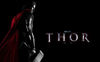 Chris Hemsworth as Thor with the hammer Mjölnir against a dark background