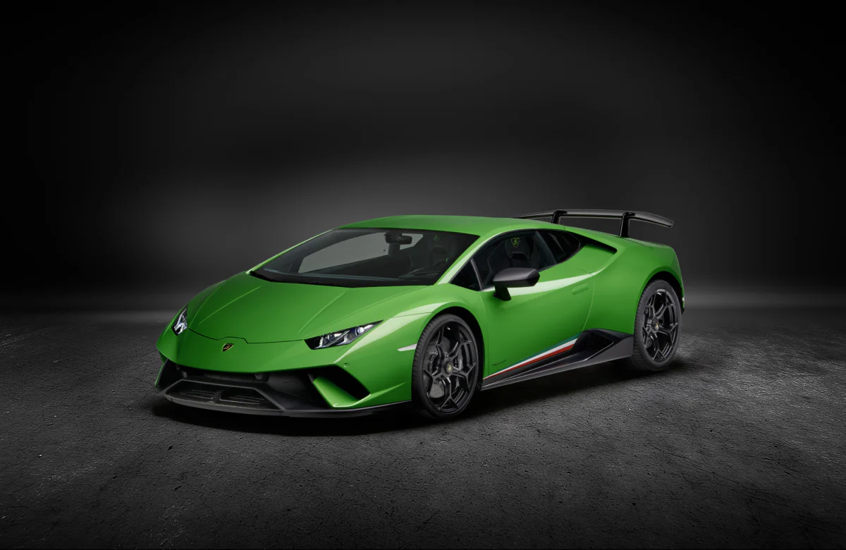 A bright green Lamborghini Huracan Performante under studio lighting