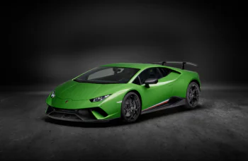A bright green Lamborghini Huracan Performante under studio lighting