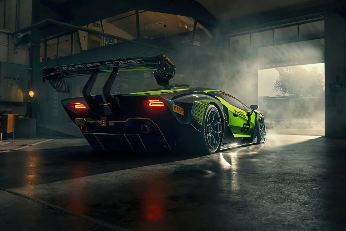 The Lamborghini Essenza SCV12 race car bathed in light in the garage