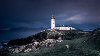 The Faned Head Lighthouse at twilight on the coast of Ireland