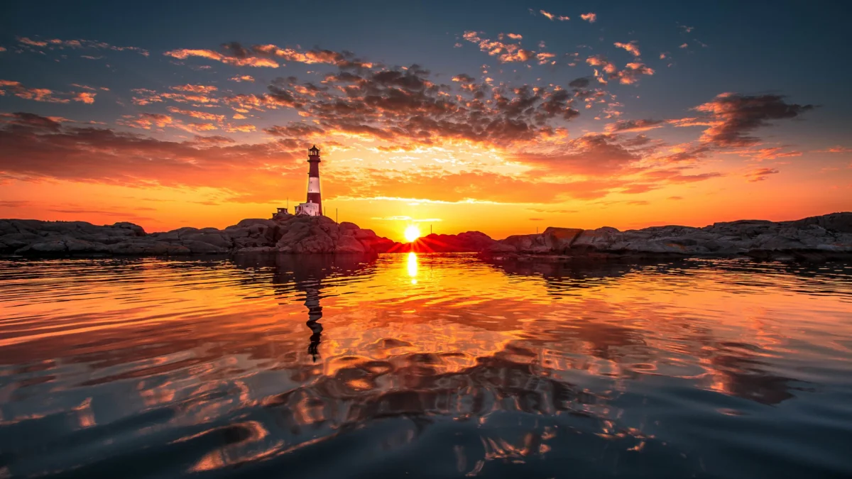 The Langesunn Lighthouse against the backdrop of a blazing sunset in Norway
