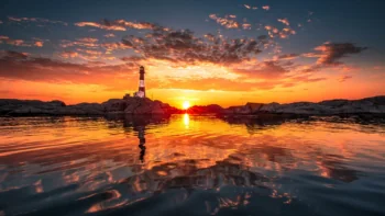 The Langesunn Lighthouse against the backdrop of a blazing sunset in Norway