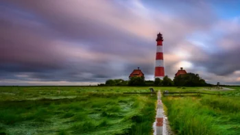 The Westerheeverzand Lighthouse against a dramatic sky in Germany