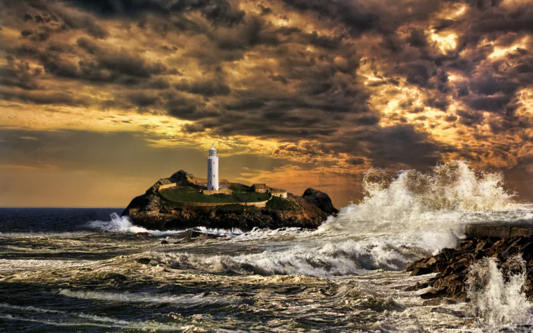 The lighthouse on Mangles Island, surrounded by the raging ocean