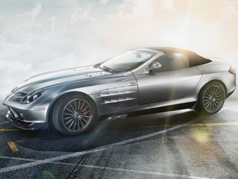 A silver Mercedes-Benz SLR McLaren 722 S on sun-drenched asphalt