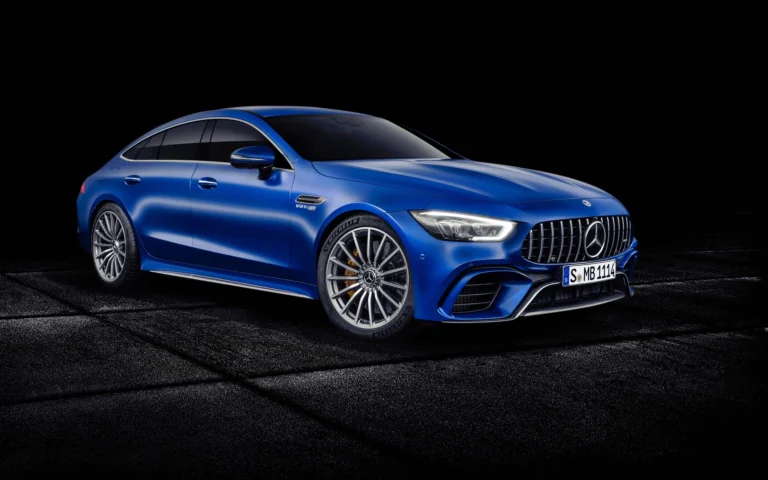 A blue Mercedes-AMG GT 4-Door Coupe against a dark background