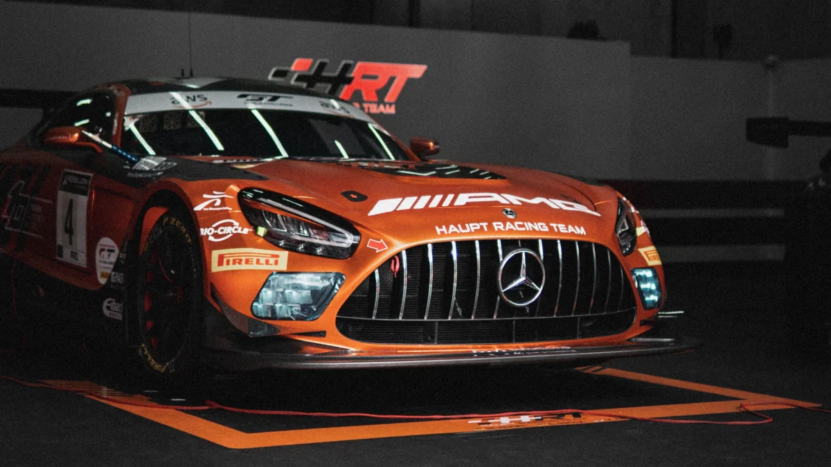 A Mercedes-AMG GT3 race car in the Haupt Racing Team's pit