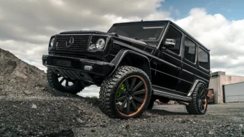 A black Mercedes-Benz G-Class on a rocky slope