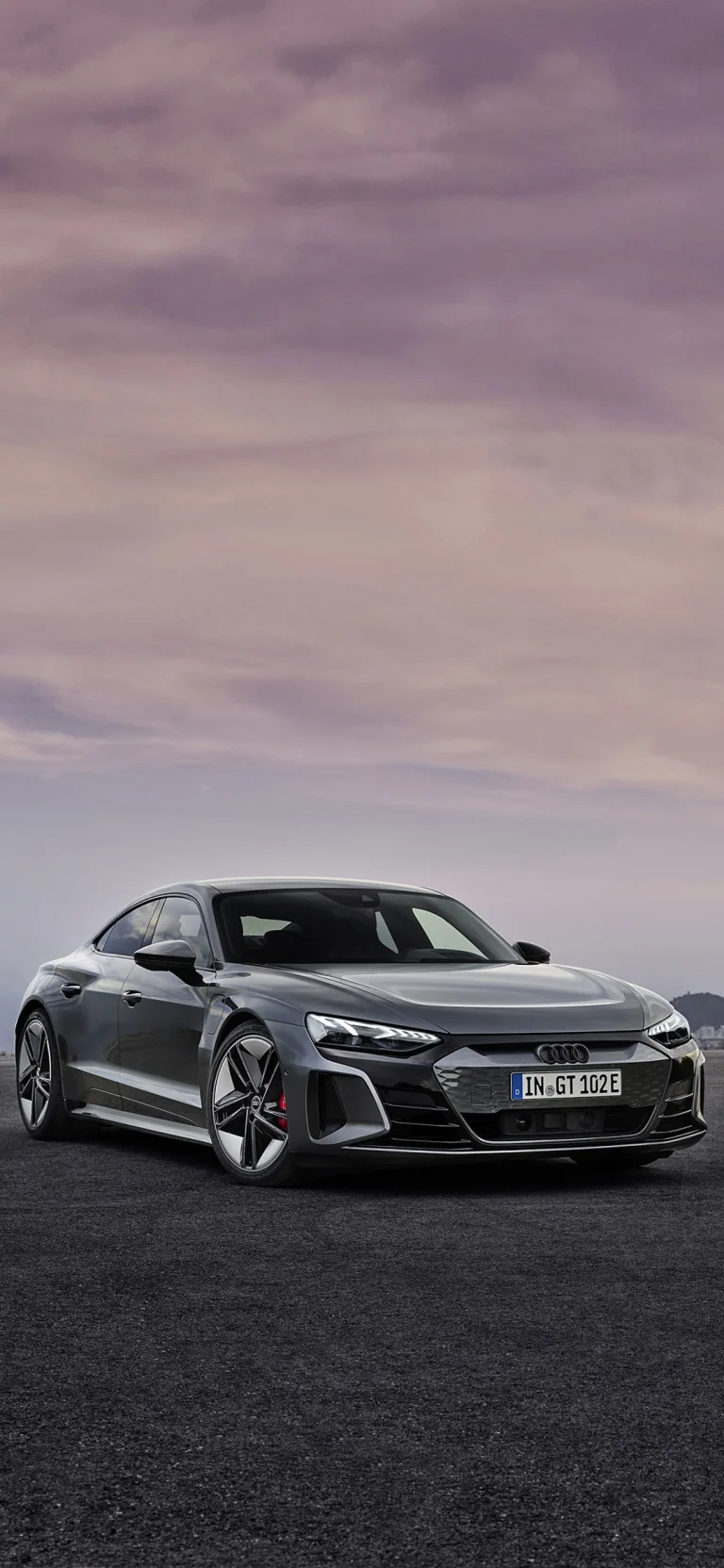 The Audi e-tron GT against the backdrop of the pre-sunset sky