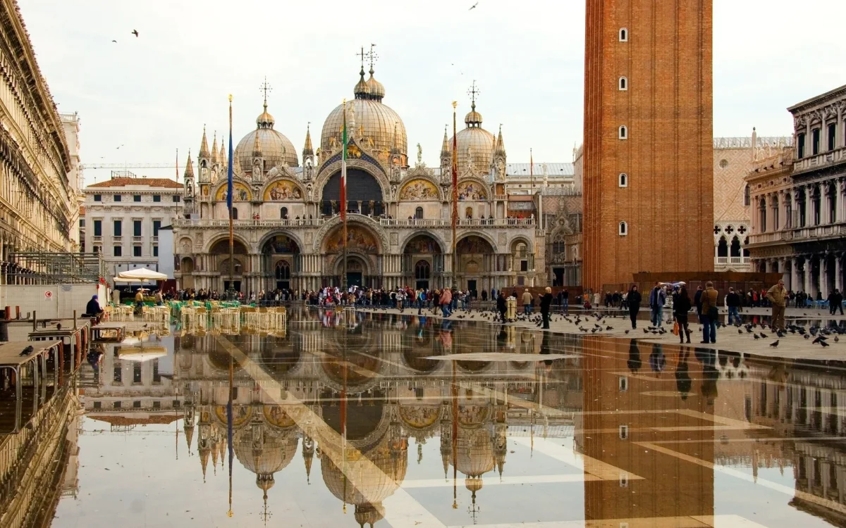 Reflection of St. Mark's Basilica in the puddles on St. Mark's Square, Italy