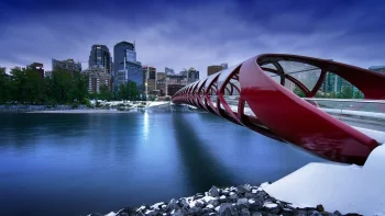 the red peace bridge against the backdrop of calgary at dusk, attractions, bridges, canada, cityscape, cityscapes, clouds, evening, evenings, twilight, dus, night lights, lights, streetlights, street lamps, lighting, night, rivers, canals, streams, skyscrapers, winter, winters, architecture, world