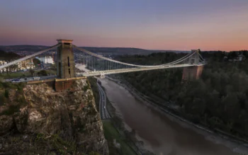 The Clifton Suspension Bridge bathed in the glow of the sunset over Bristol