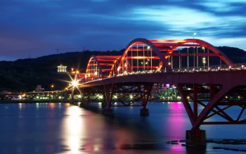 the red arches of the hedao bridge in taiwan, guandu bridge, taiwan, bridges, engineering marvel, engineering structures, evening, evenings, twilight, dus, mountains, peaks, hills, night lights, lights, streetlights, street lamps, lighting, night, reflections, rivers, canals, streams, waterfronts, marinas, architecture, world
