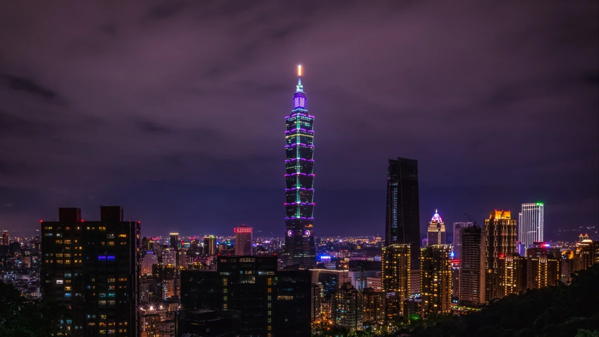 The gleaming Taipei 101 skyscraper against a dark sky