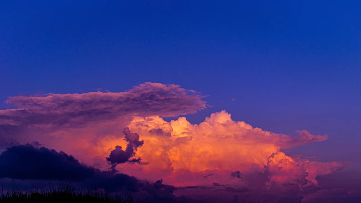 Flaming clouds against the backdrop of the evening sky