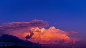 Flaming clouds against the backdrop of the evening sky